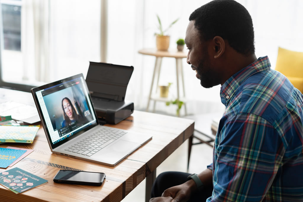 person sitting in front of laptop